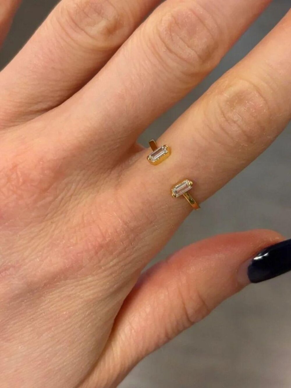 The Delaney gold plated CZ ring with baguette pendants open